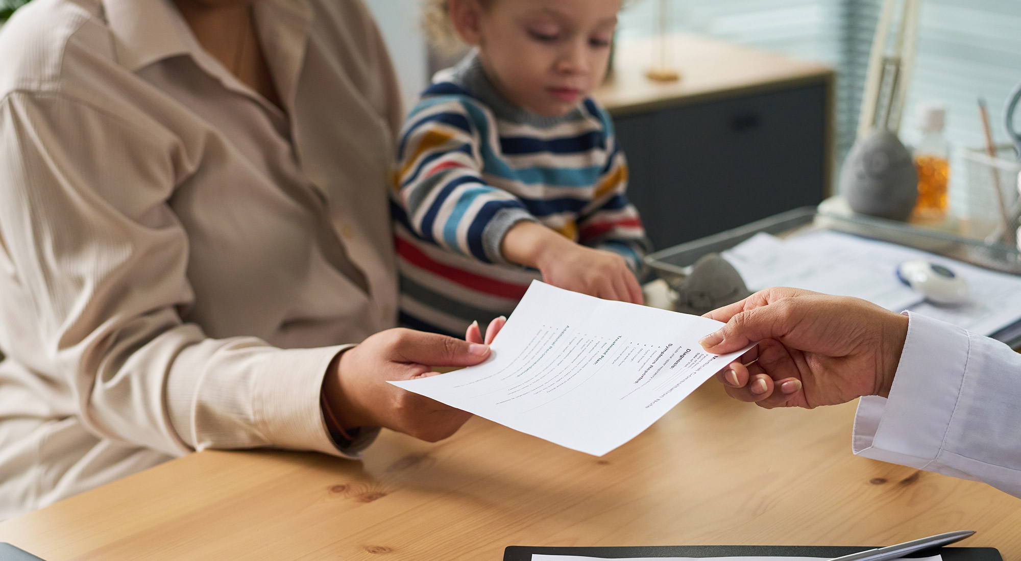 Family reviewing health insurance benefits for ABA therapy