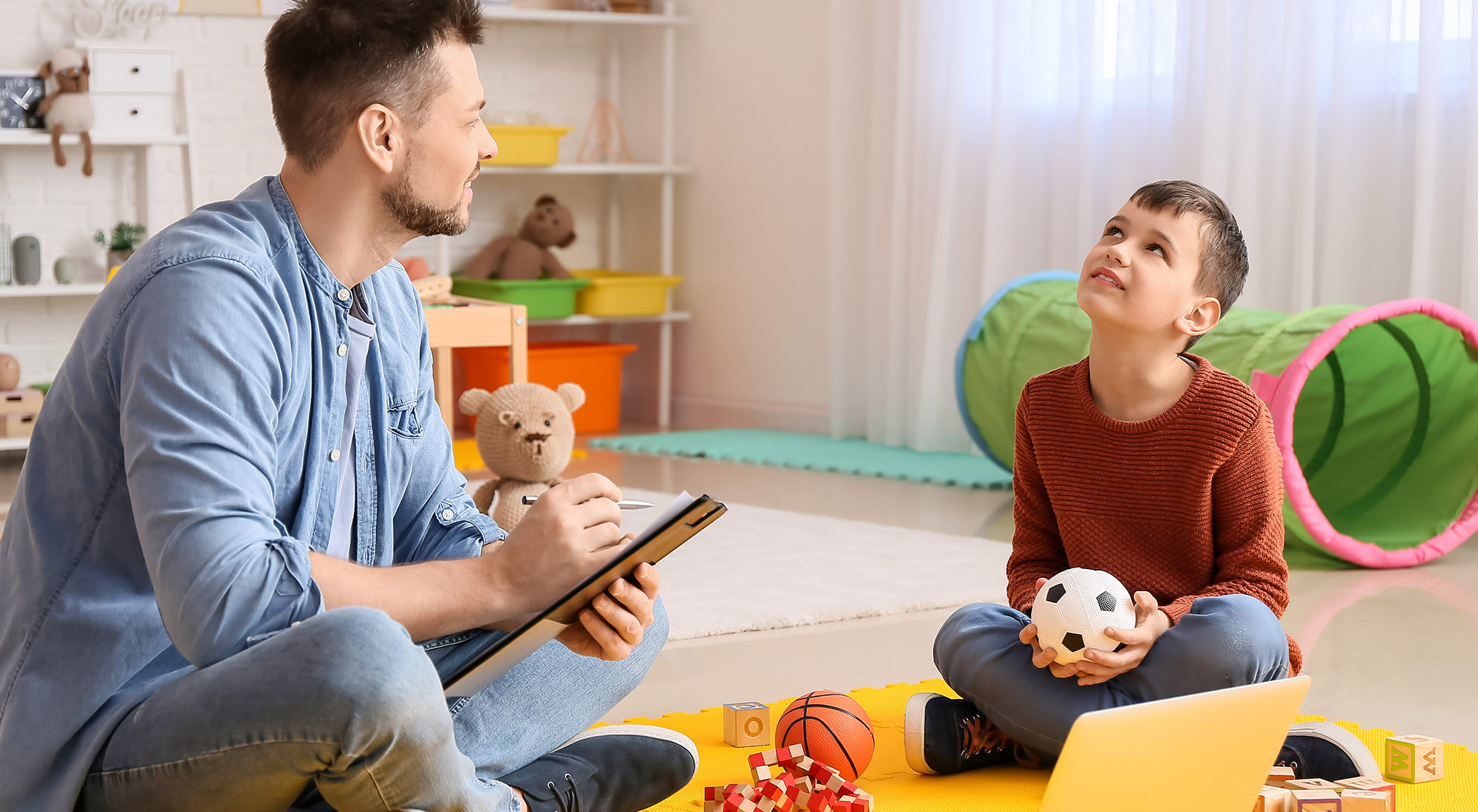 Child practicing functional communication during an ABA therapy session