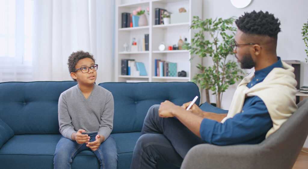 ABA therapist tracking a child’s progress during a therapy session