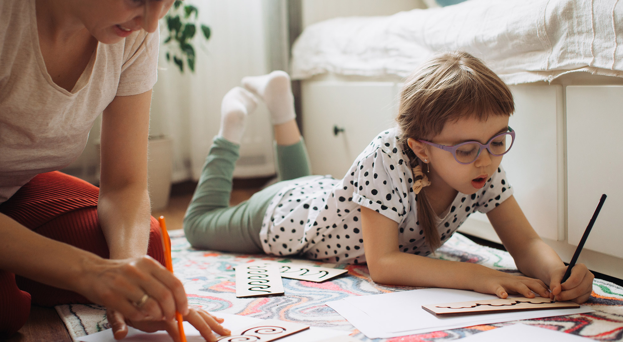 Child participating in ABA and occupational therapy activities with a therapist