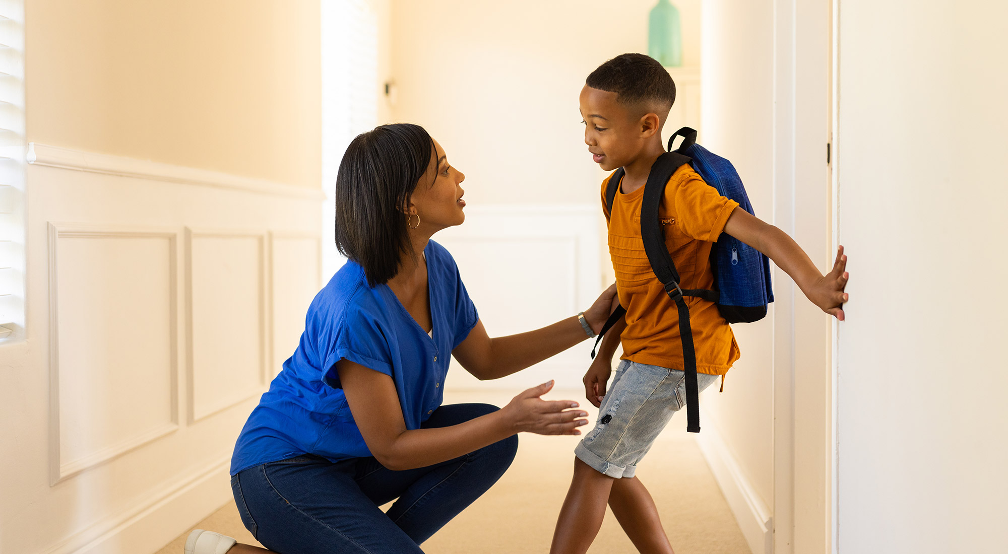 - Parent helping child with ABA therapy transitions during a routine change